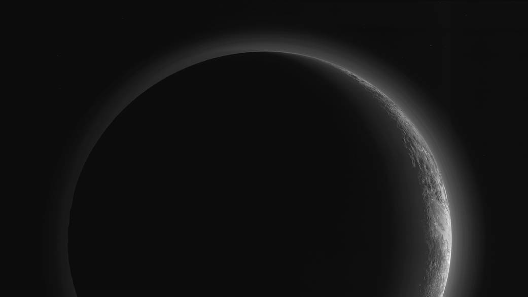 This image, taken 15 minutes after the New Horizons spacecraft’s closest approach to Pluto on July 14, reveals the distant world’s rugged terrain and atmospheric haze layers. This image, first published in early September, was re-released by NASA Thursday after further image progressing to bring out details. Credit: NASA/JHUAPL/SwRI