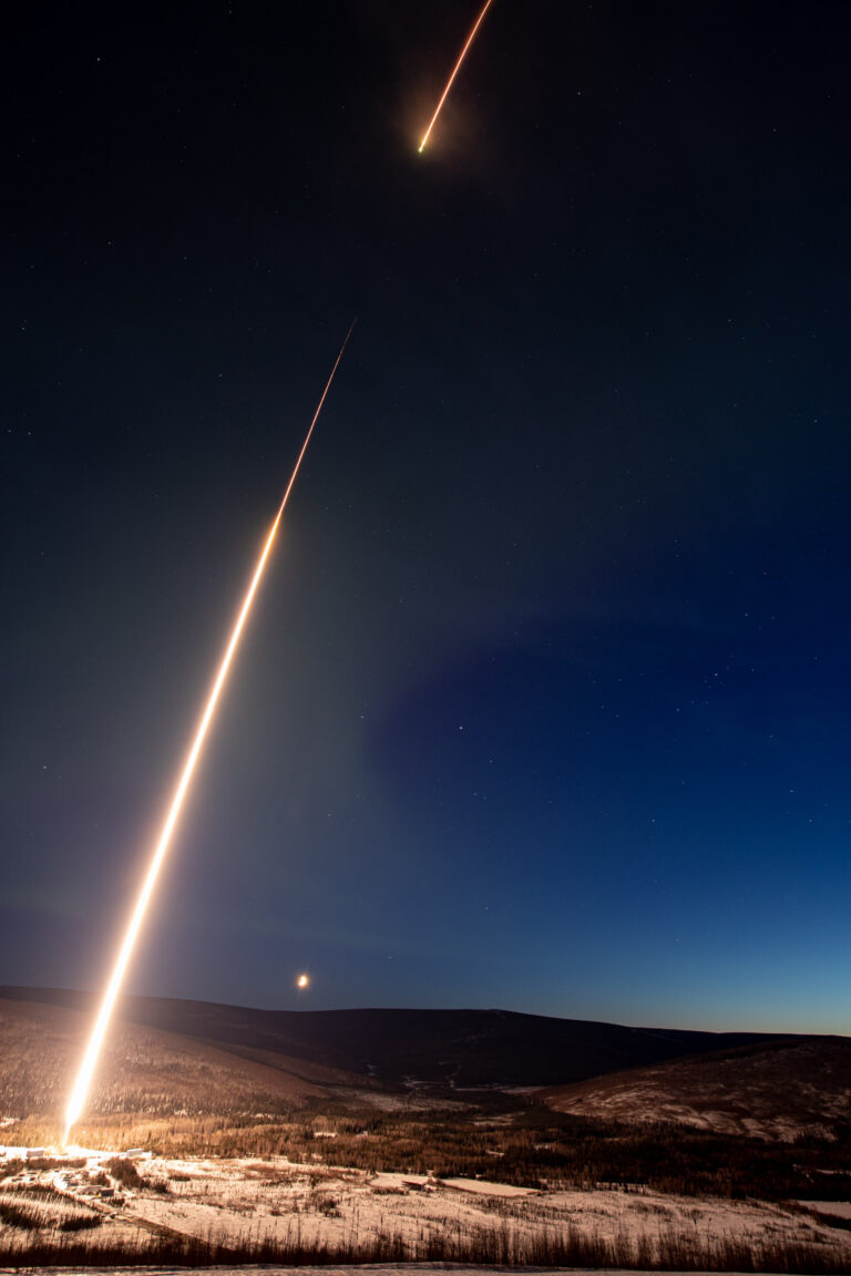 INCAA space craft launching with a bright tail at night