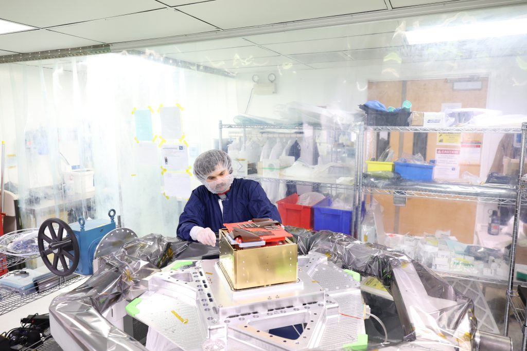 Aerospace Engineer Bradley Pafchek assembling the payload for the COSI mission.
