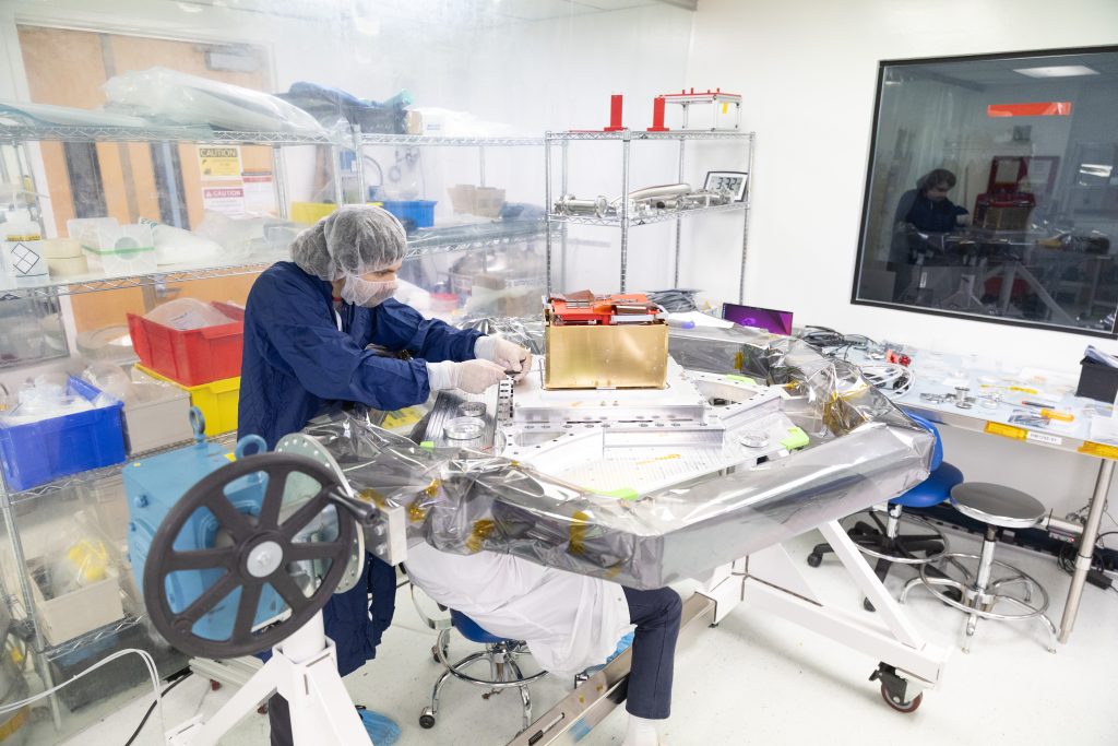 Aerospace Engineer Bradley Pafchek assembling the payload for the COSI mission.