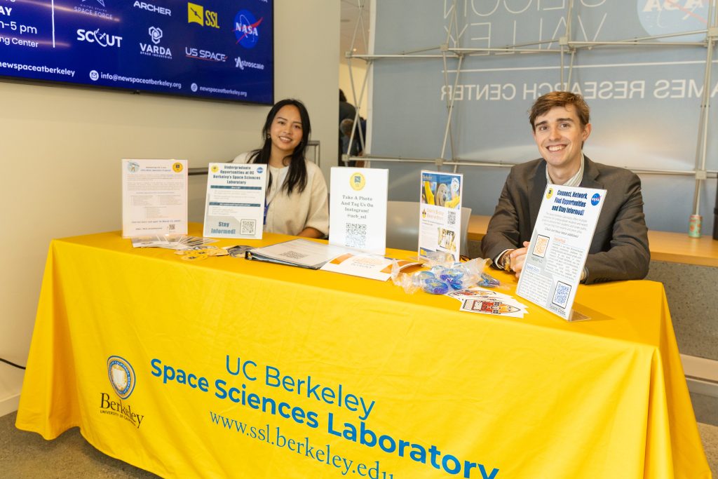 Helen Vo, undergraduate community & opportunity builder at SSL, and Brett Bonine, mission operations lead at SSL, tabling at Berkeley Space Symposium 2025.