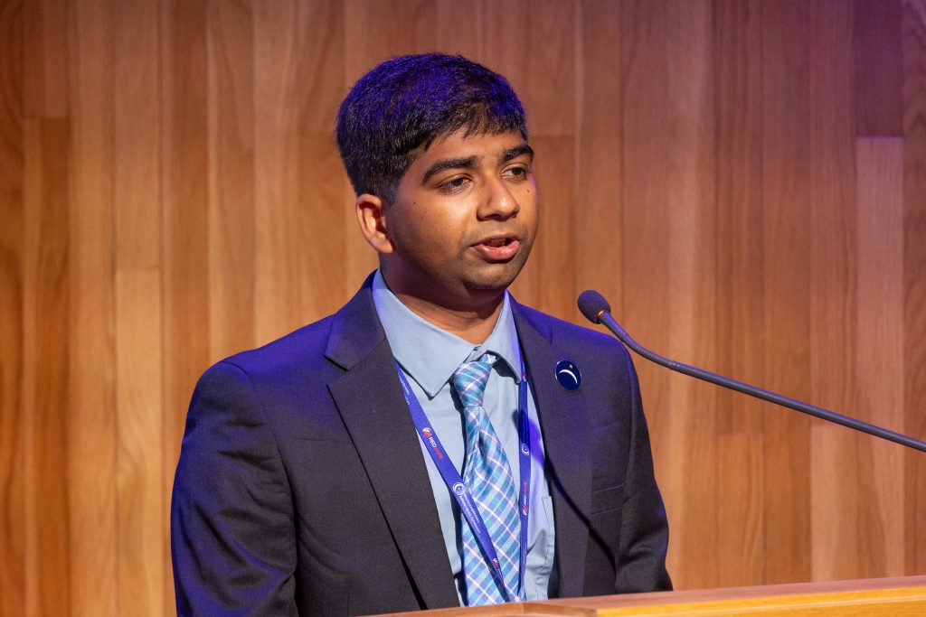Anuj Kakde, chief operating officer of NewSpace@Berkeley, speaking at the Berkeley Space Symposium 2025.